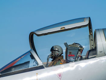 Close-up of ship against clear blue sky