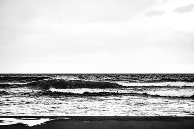 Scenic view of beach against clear sky