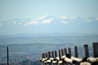Scenic view of sea and mountains against sky