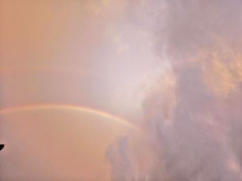 Low angle view of rainbow against sky