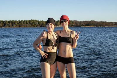 Smiling women at lake