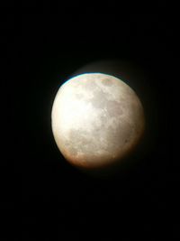 Close-up of moon over black background