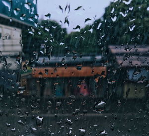 Raindrops on glass window during rainy season