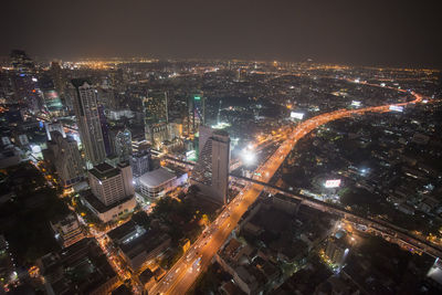 Aerial view of illuminated cityscape at night