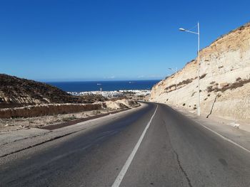 View of road against clear blue sky