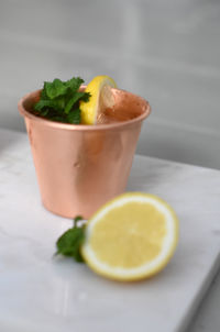 Close-up of lemon served in plate on table