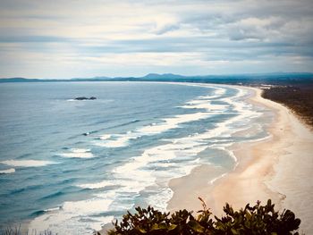 Scenic view of beach against sky