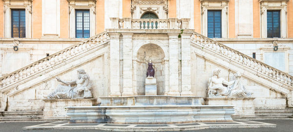 Statue in front of historical building