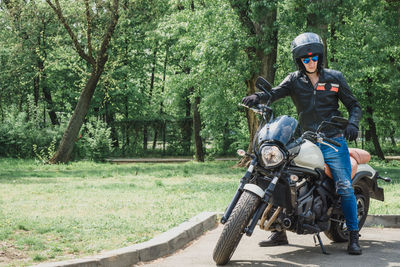 Full length of man riding motorcycle