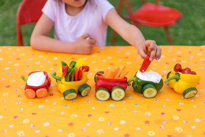 Portrait of girl with train made from vegetables