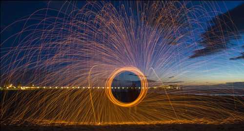 Light trails against sky at night