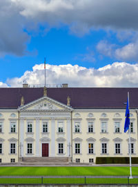 Low angle view of building against cloudy sky