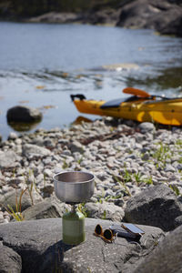 Camping gas burner on rocky coast