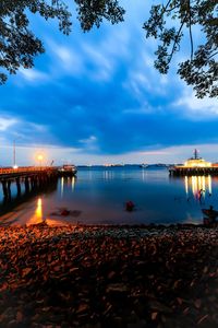 Scenic view of sea against sky at dusk