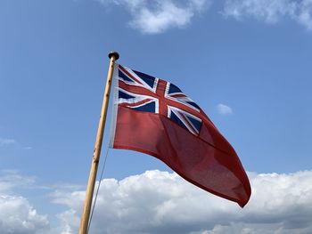 Low angle view of flag against sky