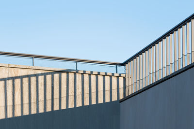 Low angle view of metallic structure against clear sky