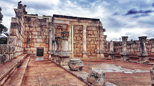 Old ruin building against cloudy sky