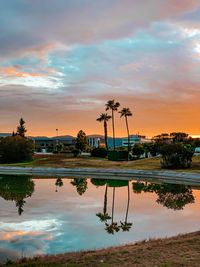 Scenic view of lake against sky during sunset