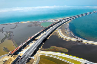 High angle view of bridge over sea against sky