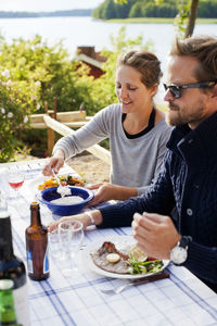 Couple having meal outdoors