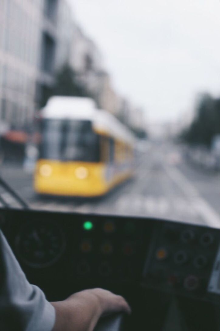 CLOSE-UP OF AIRPLANE FLYING OVER BLURRED MOTION OF TRAIN