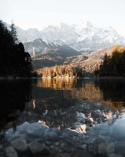 Scenic view of lake and mountains against sky