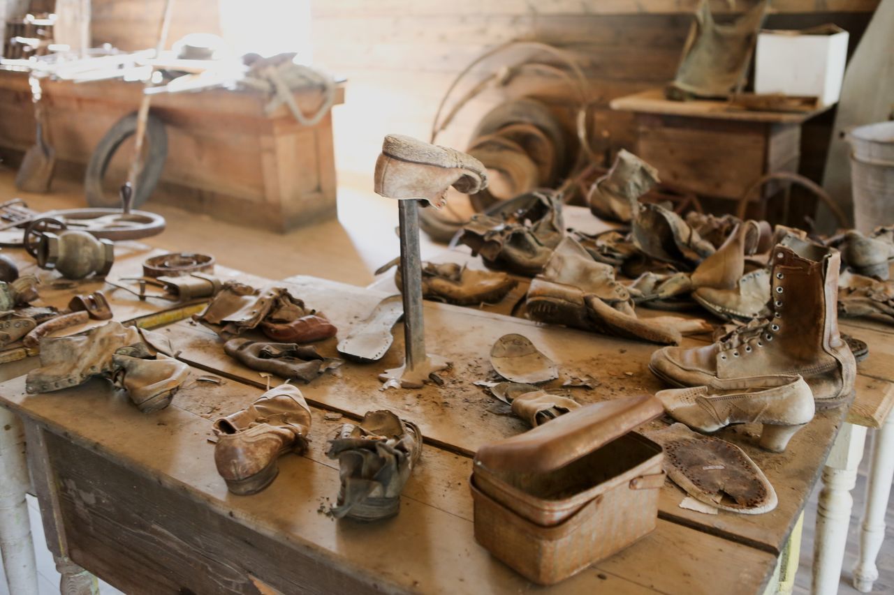 indoors, wood - material, large group of objects, still life, abundance, table, close-up, food and drink, old, metal, stack, wooden, no people, high angle view, container, variation, wood, shelf, preparation, food