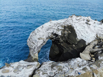 High angle view of rock formation on beach