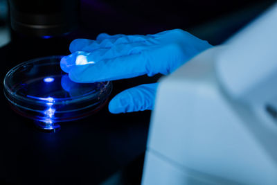 Cropped hand of scientist working in laboratory