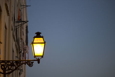 Low angle view of street light against clear sky