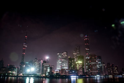 Illuminated buildings in city at night