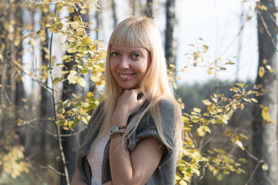 Portrait of smiling woman standing outdoors