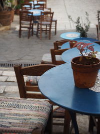 Close-up of chairs and table in cafe