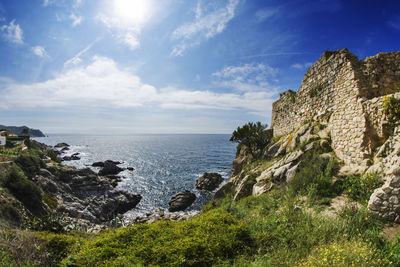 Scenic view of sea against cloudy sky