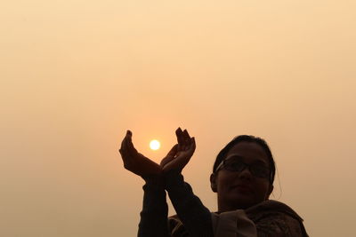 Close-up of woman during sunrise