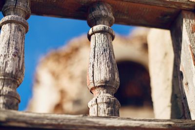 Low angle view of cross on old building