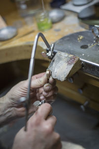 Midsection of person working on cutting board