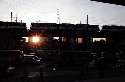 Cars on road at sunset