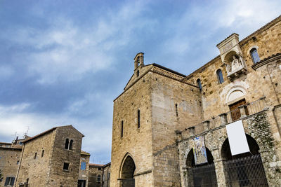 Low angle view of old building against sky