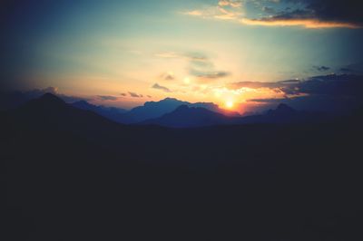 Scenic view of mountains at sunset