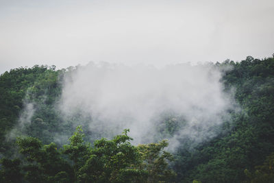 Scenic view of waterfall against sky