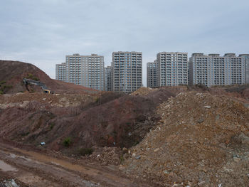 Buildings in city against sky