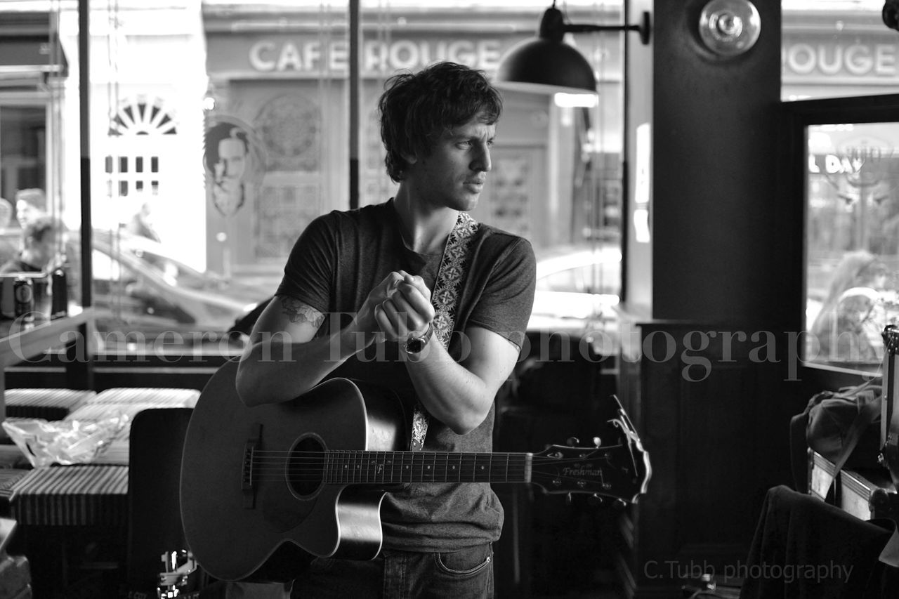 music, arts culture and entertainment, guitar, musical instrument, musician, guitarist, one person, plucking an instrument, acoustic guitar, adults only, performance, lifestyles, one man only, playing, only men, adult, leisure activity, people, singer, young adult, popular music concert, indoors, day