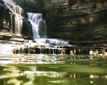 People swimming in river