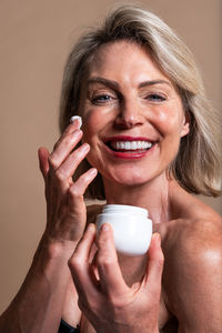 Close-up of young woman drinking coffee at home