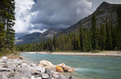 Scenic view of lake and mountains against sky