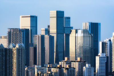 Skyscrapers in city against sky