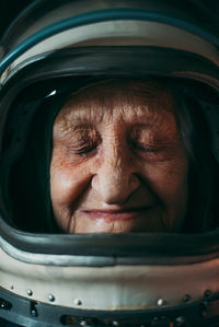 Close-up portrait senior woman wearing space suit