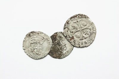 Close-up of coins on white background