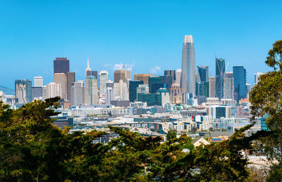 Modern buildings in city against sky